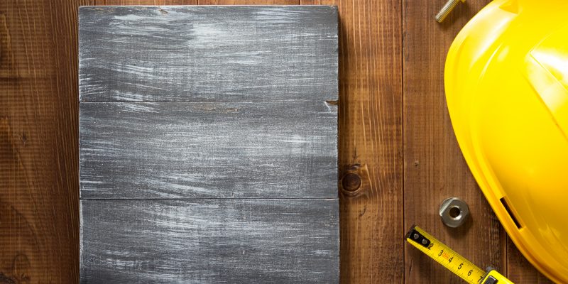 construction tools on wooden background